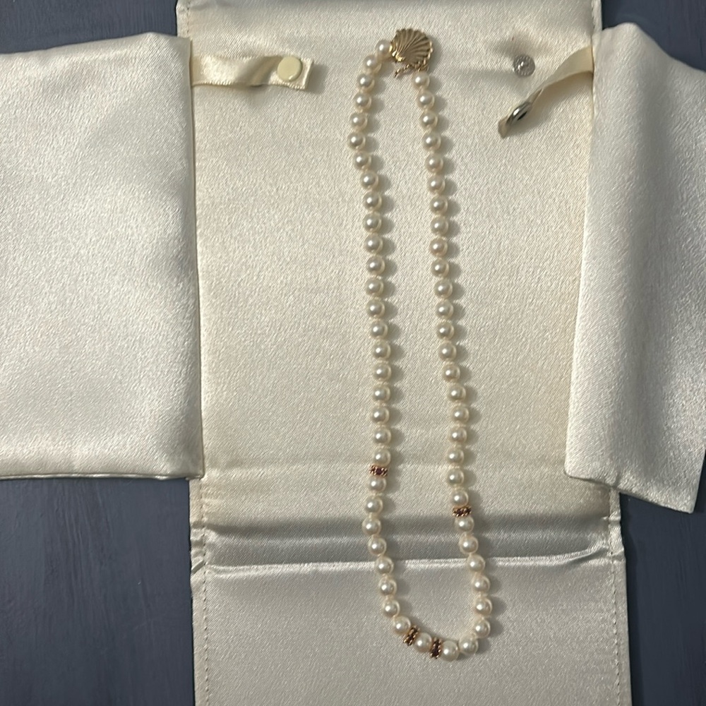 18 inch rose colored cultured  pearls6 1/2 to 7 mm pearls. 4 rondels of Rubies.